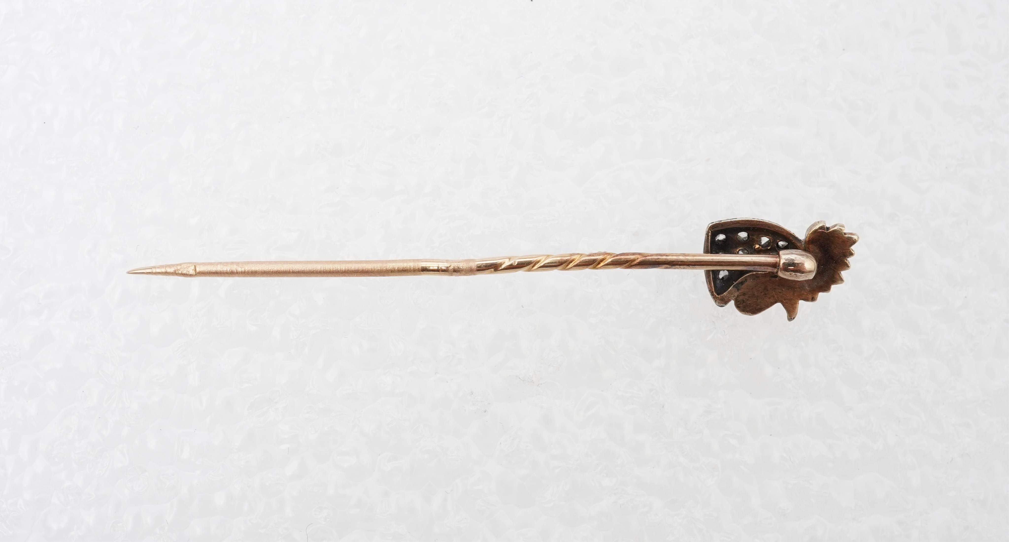 An enamel and diamond stick pin, circa 1900